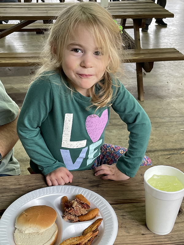 Izzi Dincan gets ready to dig in her BBQ plate at this year's Harry McKee Memorial Fundraiser. The event was held Saturday, Nov. 9, 2024.  