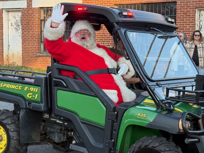 Ho! Ho! Ho! Santa waves to everyone.