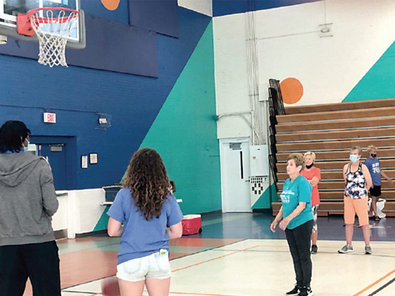  Ann McSwain demonstrated her basketball shooting.