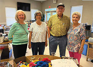 Volunteers at Christmas in July Indoor Flea Market & Vendor Sale