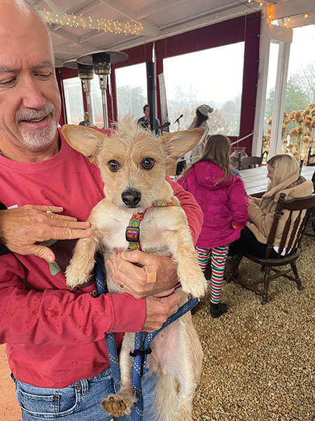 Yatzee, a former C.A.R.E. dog, that was adopted by Phil and Joy Hunt, was enjoying the festivities at the Baker Buffalo Creek Vinyard and Winery venue