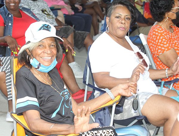 Jackie Peeler and Kathleen Sanders listen to the music of the Java Band at the August Shelby Alive Concert. 