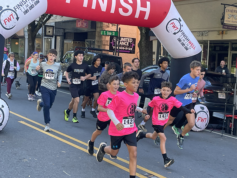 These kids take off at the start of the Clifford's Uptown Hounds 5K walk/run.