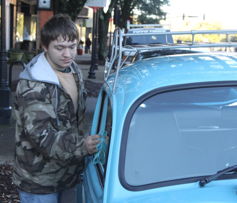 Josh Grant details his 1972 Volkswagen Bug at the Cars and Coffee event in Uptown Shelby on January 13th, 2024. 