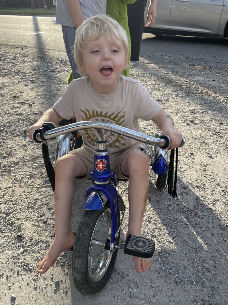 Gerald Scronce tries out a tricycle he got at the Casar townwide yard sale last Saturday, September 7th. 