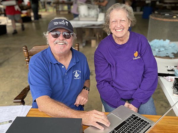 Doyle Neason and Debra Mellon take up money at the Harry McKee Memorial BBQ Fundraiser.  