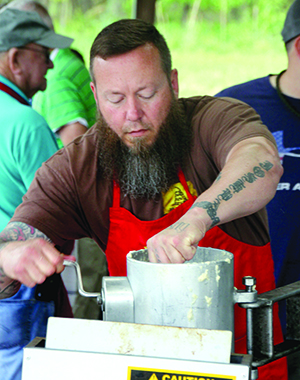 Brian Mellon fries hush puppies at the Piedmont Shrine Club Fish Fry 