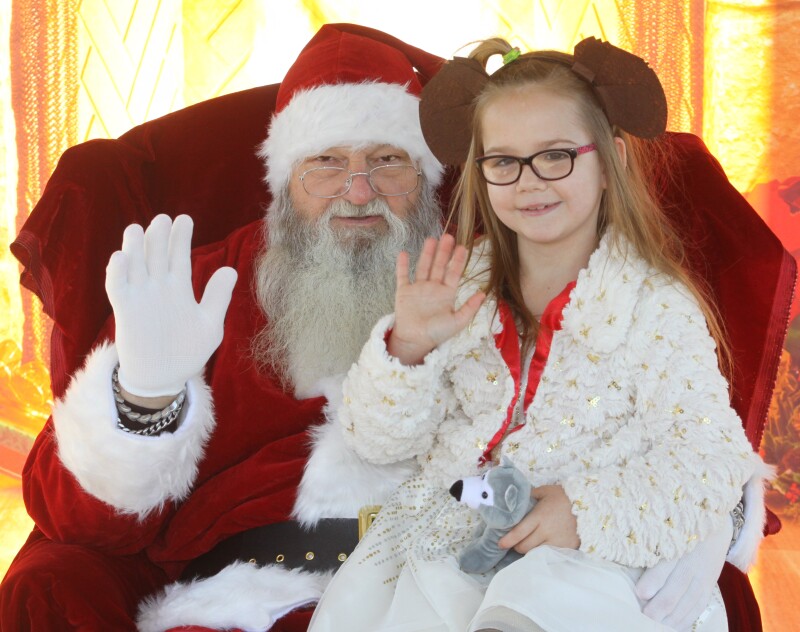 Desiray Murray gets her photograph made with Santa at the Hounds at Hanna 5K event on Saturday, November 19th. 