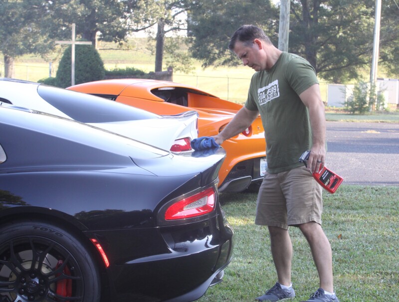 Shane Boucher puts a final touch on his 2015 Dodge Viper at the Sharon Church Car Show held Saturday, September 21st