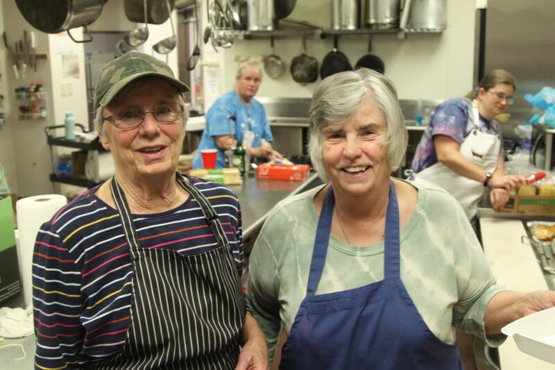 Sisters Carrol and Maggie Watson take command of the kitchen at the 2nd Annual Spray-ghetti and No Balls Dog Rescue fundraiser dinner. 