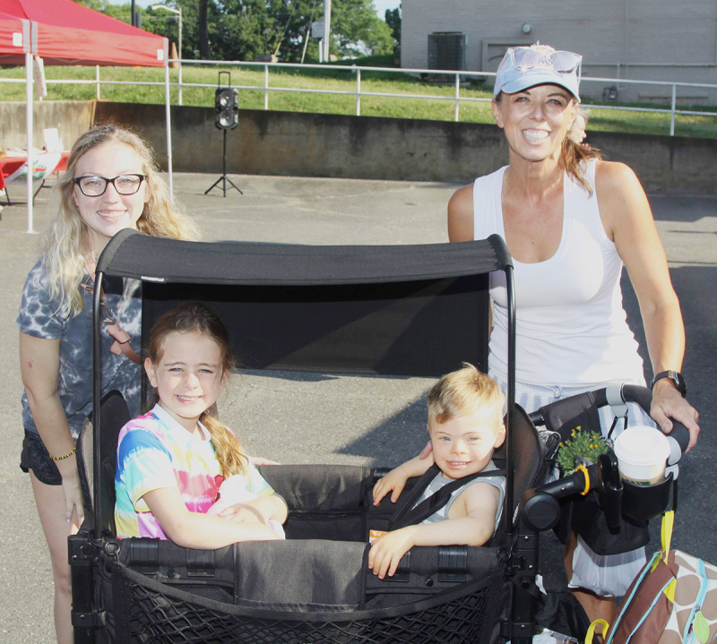 Savannah Bell and her friends Brandy, Elizabeth and Ashley Maples shop at the Kings Mountain Foothills Farmers' Market last Saturday.