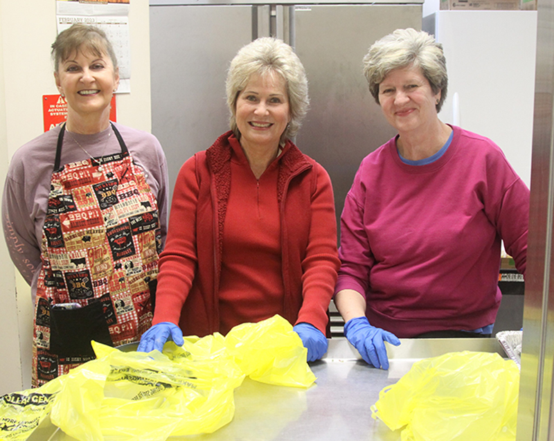 Wanda Rutherford, Sherry Henderson and Jill Shuford work the take out window at the Spay-ghetti and No Balls Dog Rescue Fundraiser Dinner 